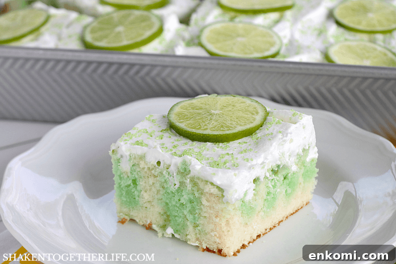 15 Irresistible Poke Cake Recipes to Try Tonight 9 piece of Lime Poke Cake topped with slice of lime on white plate