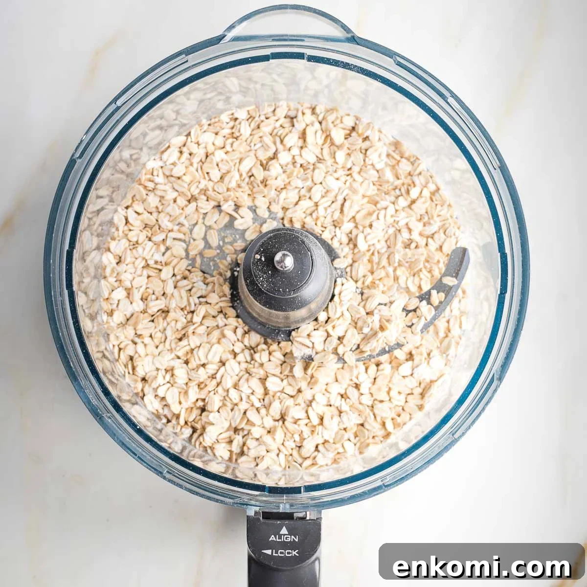 Rolled oats in the bowl of a food processor. 