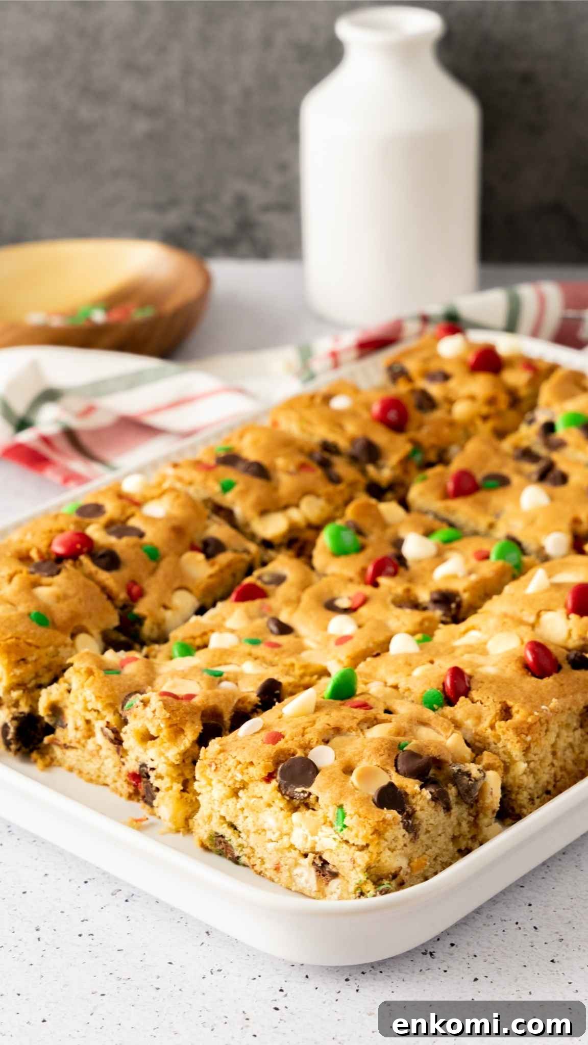Freshly cut sugar cookie bars in a baking pan for Christmas baking.