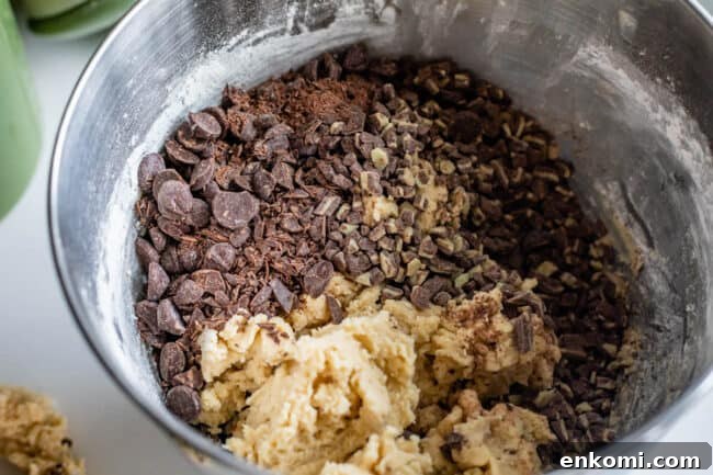 a mixing bowl with andes mints and dark chocolate ready to mix into cookie dough