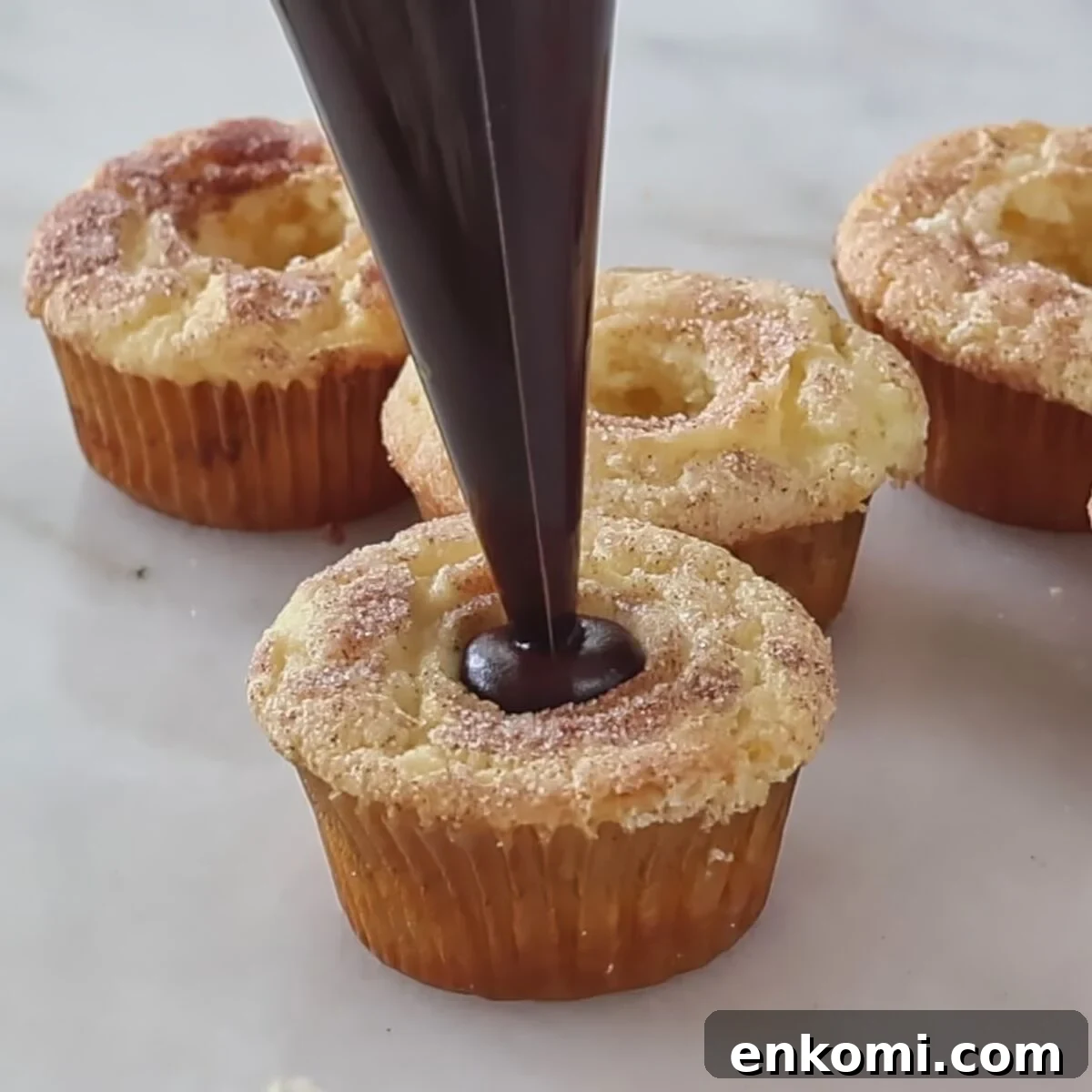 Gluten-Free Churro Cupcakes Recipe with Cinnamon Sugar Topping 18 filling cupcakes with chocolate ganache.