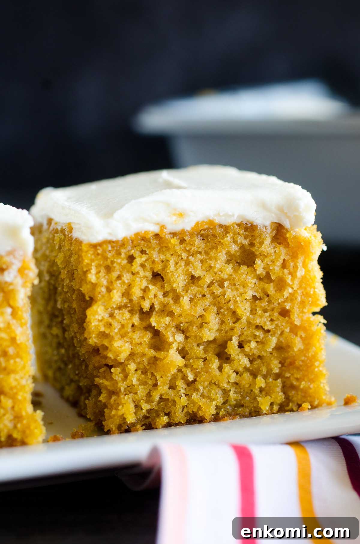 pumpkin bar with cream cheese frosting on a plate
