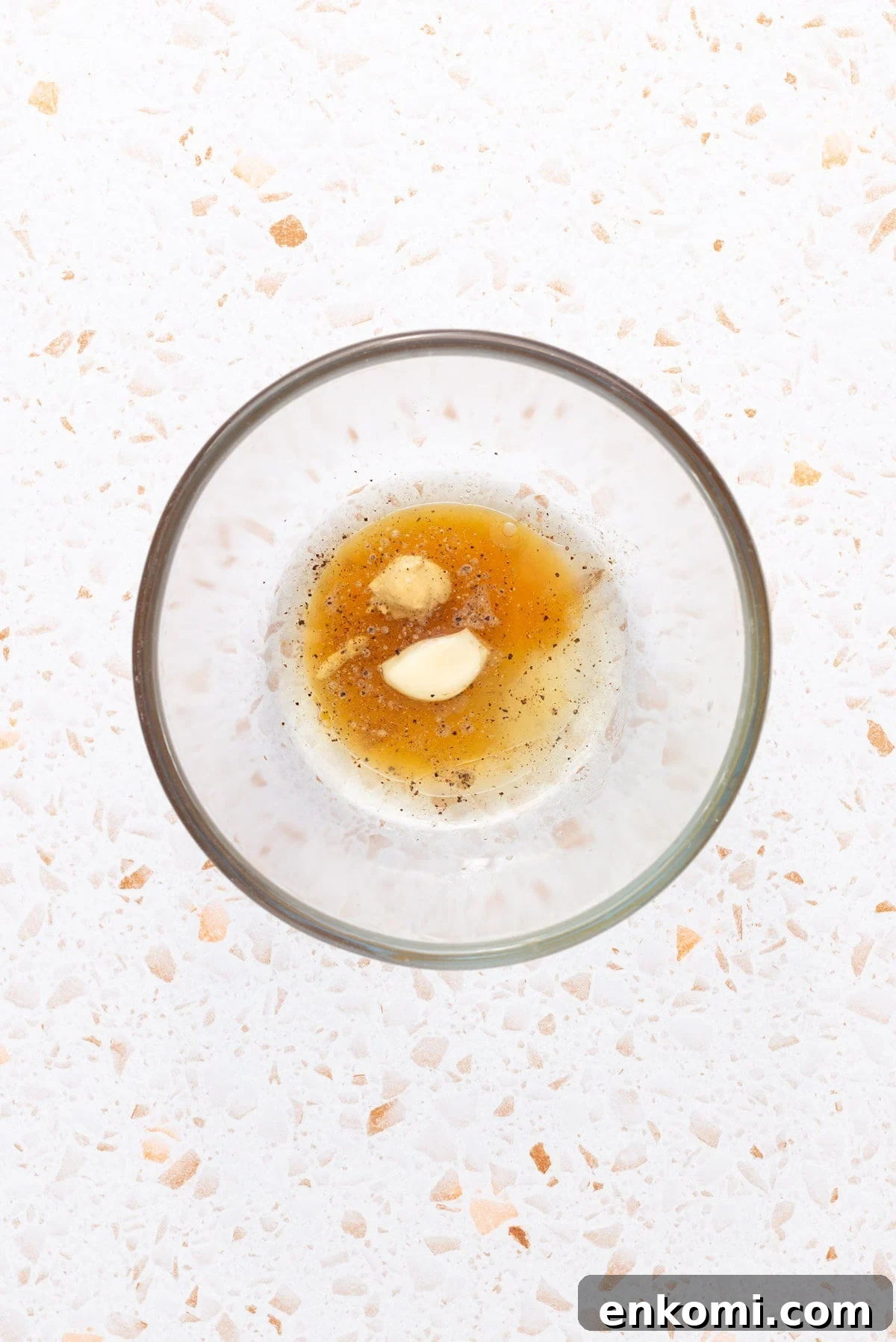An overhead image of the dressing ingredients whisked together in a medium bowl until combined
