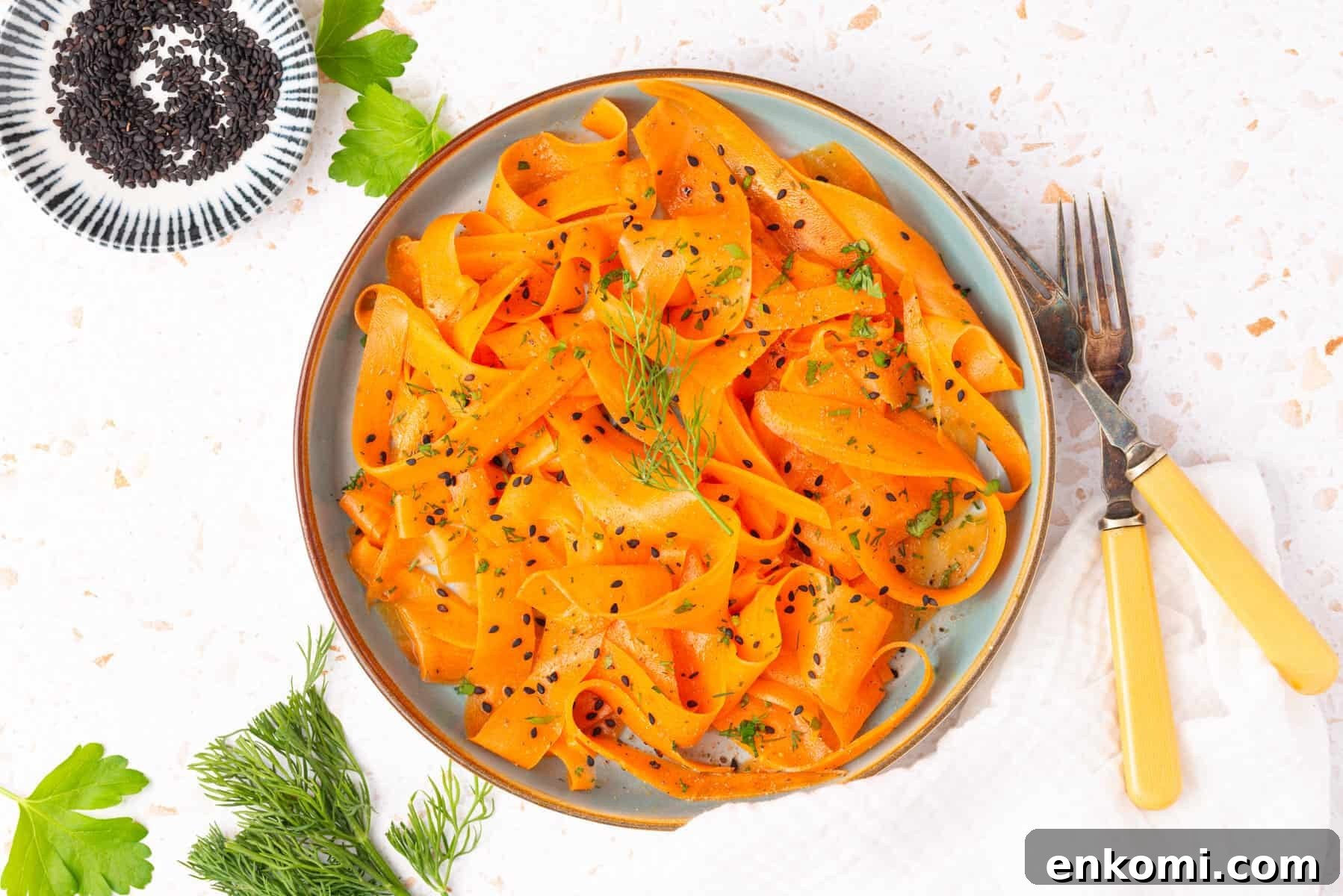 An overhead image of raw carrot salad on a plate.