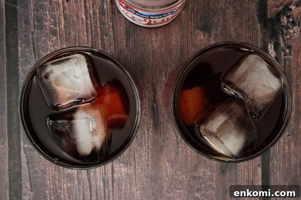 pour cranberry juice over apple whiskey