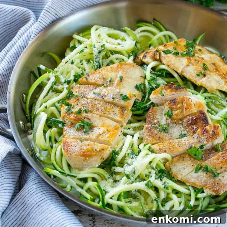chicken served over zucchini noodles for creamy alfredo pasta 