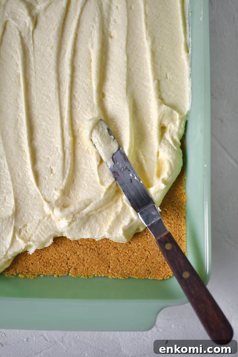 Decadent Banana Split Layer Cake Recipe 8 Topping the cooled crust with the whipped filling.