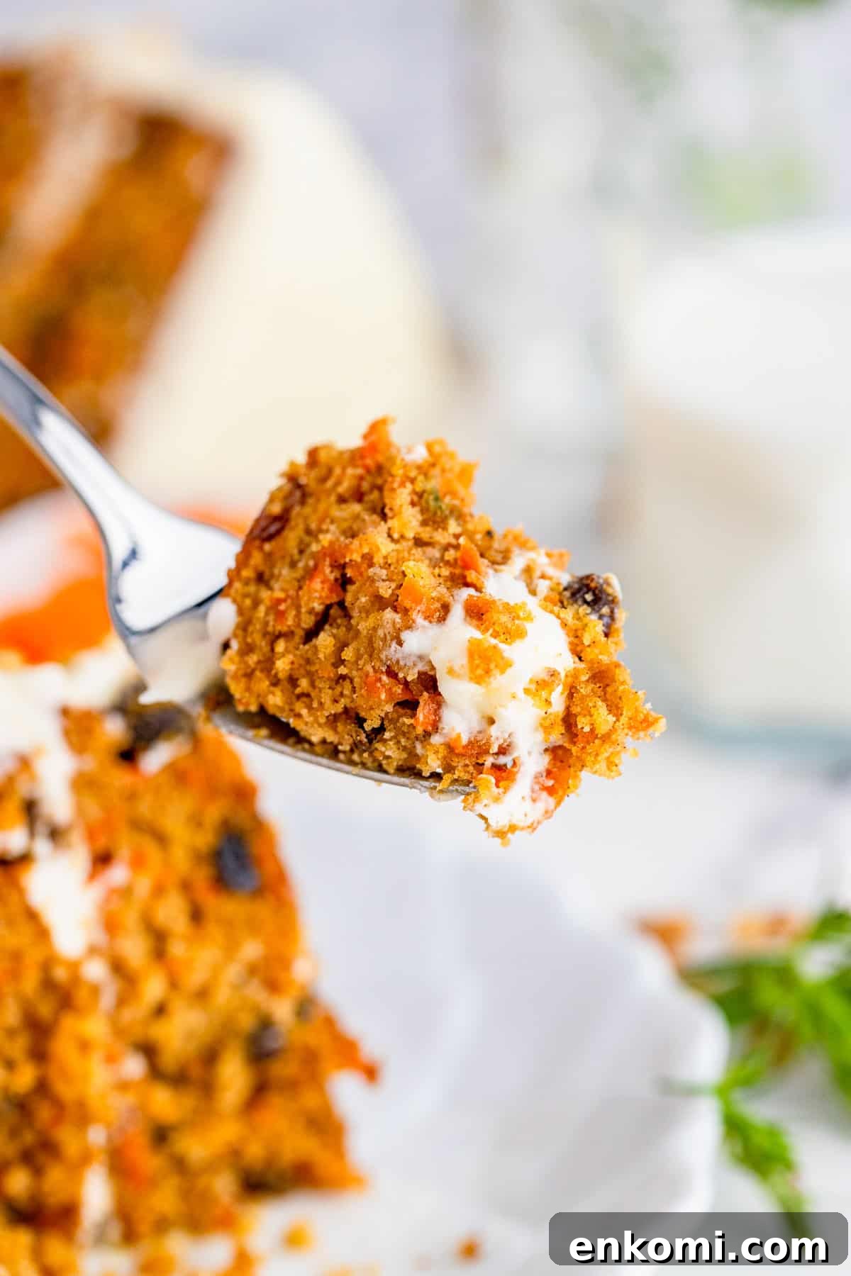 Fork holding up piece of cake