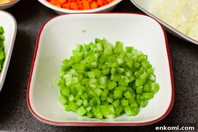 chopped celery and other vegetables in the background
