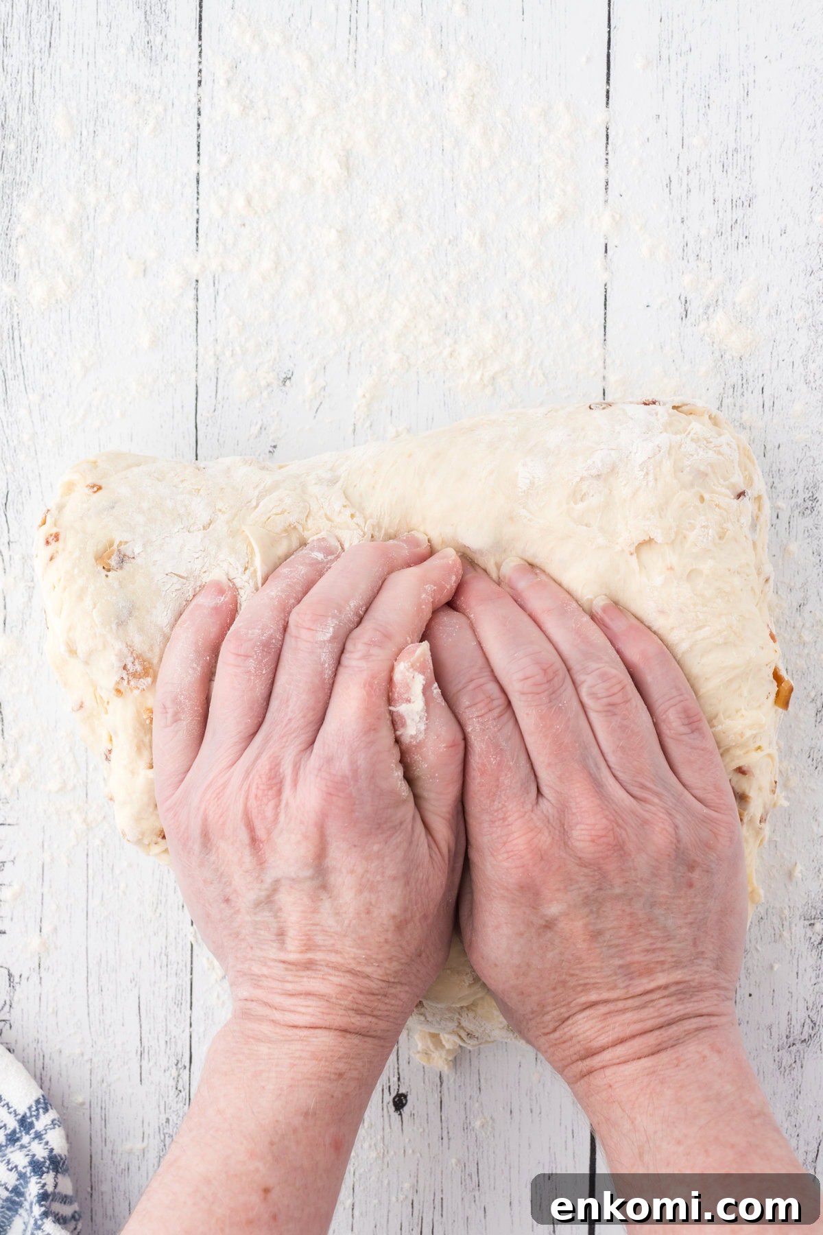 Troubleshooting Yeast Bread: Common Problems and Fixes 3 Hands kneading bread dough.