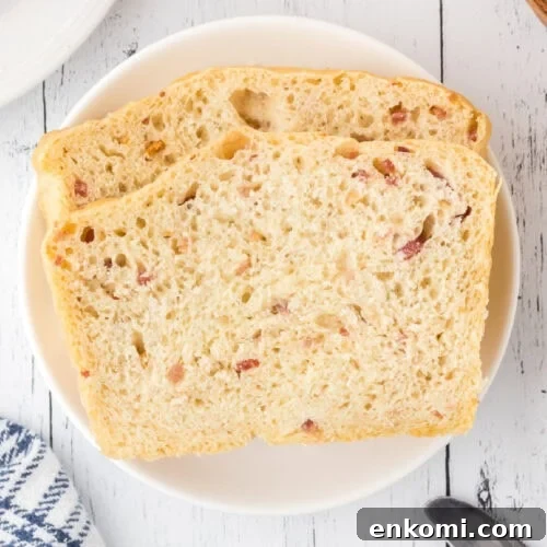 2 slices of bacon bread on a plate.