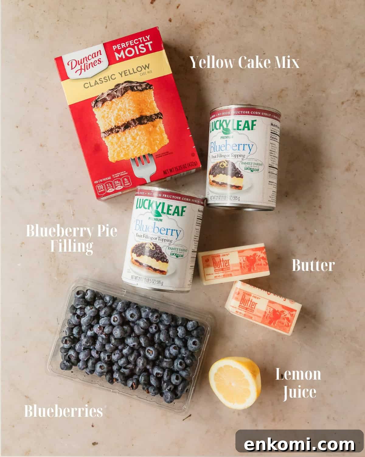 Gather blueberry pie filling, fresh blueberries, yellow cake mix, lemon juice and butter.