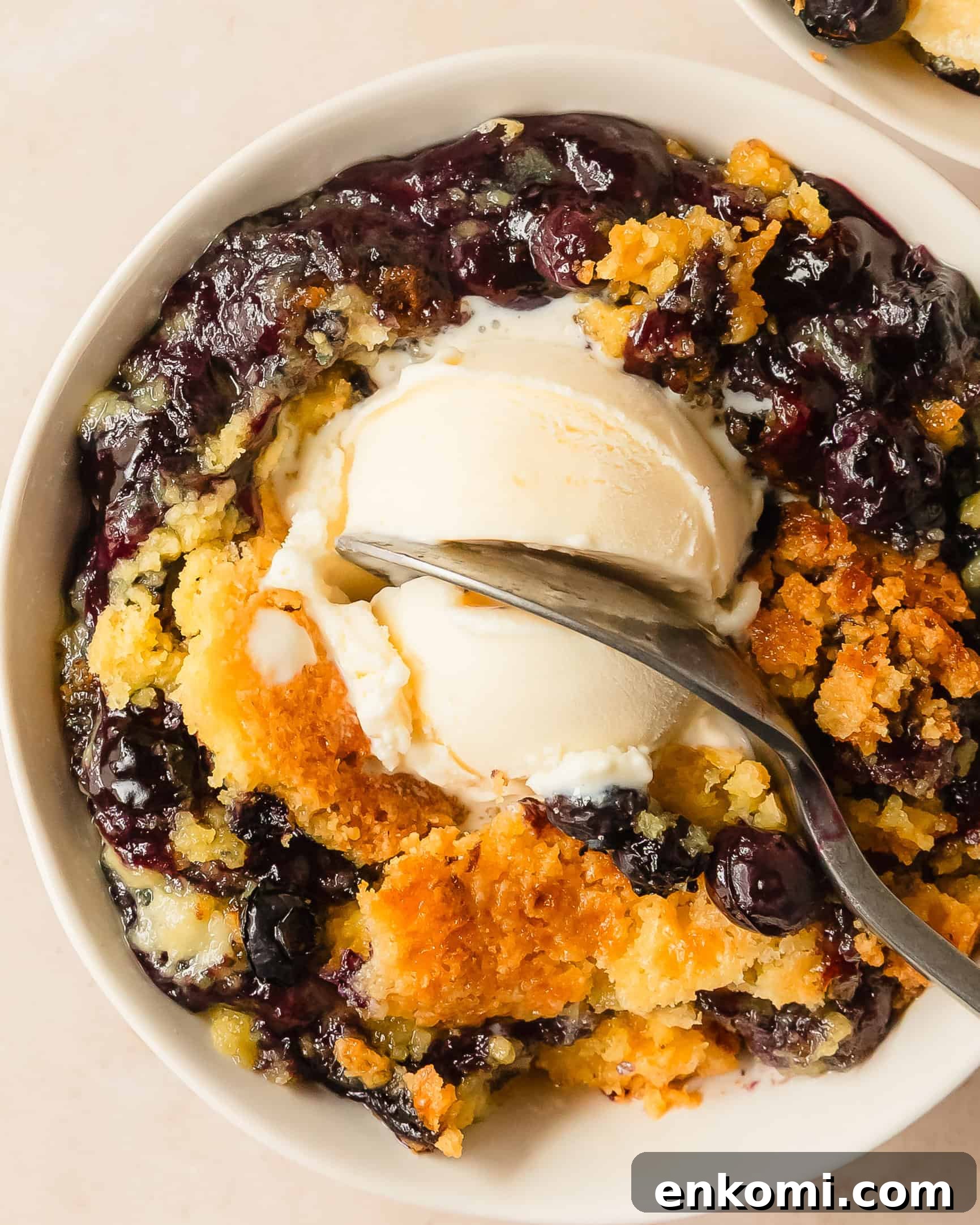 Blueberry dump cake is a quick, easy to make and delicious 5 ingredient blueberry cobbler made with cake mix blueberry pie filling and fresh blueberries. Top this blueberry cobbler dump cake with vanilla ice cream for the perfect easy blueberry dessert.
