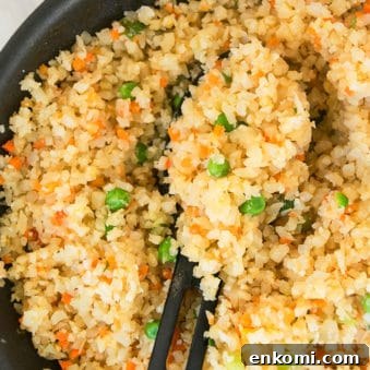 Easy One Pot Cauliflower Fried Rice With Black Spoon.