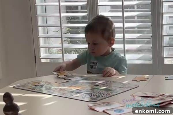 Child working on a large piece puzzle at a table, one of the fun and easy indoor preschool activities listed.
