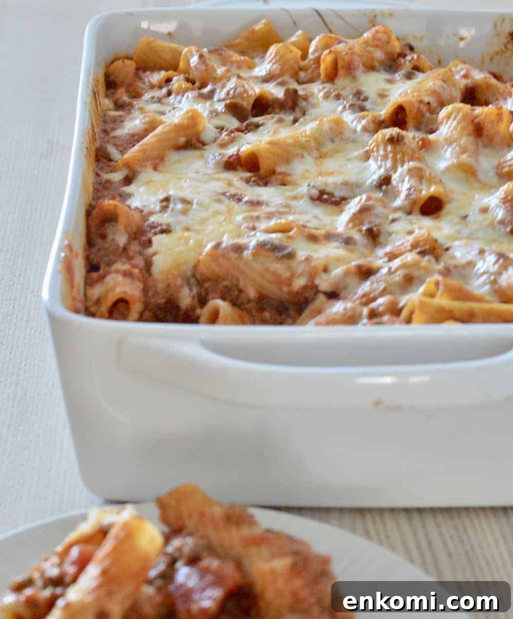 Classic Baked Ziti with Rich Meat Sauce 3 Baked Ziti with meat sauce in a white baking dish.