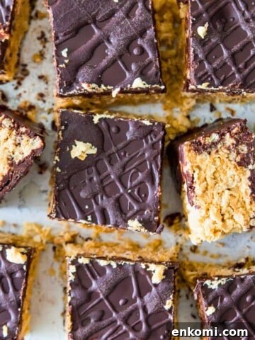 A batch of peanut butter and chocolate Rice Krispie Treats cut into squares.