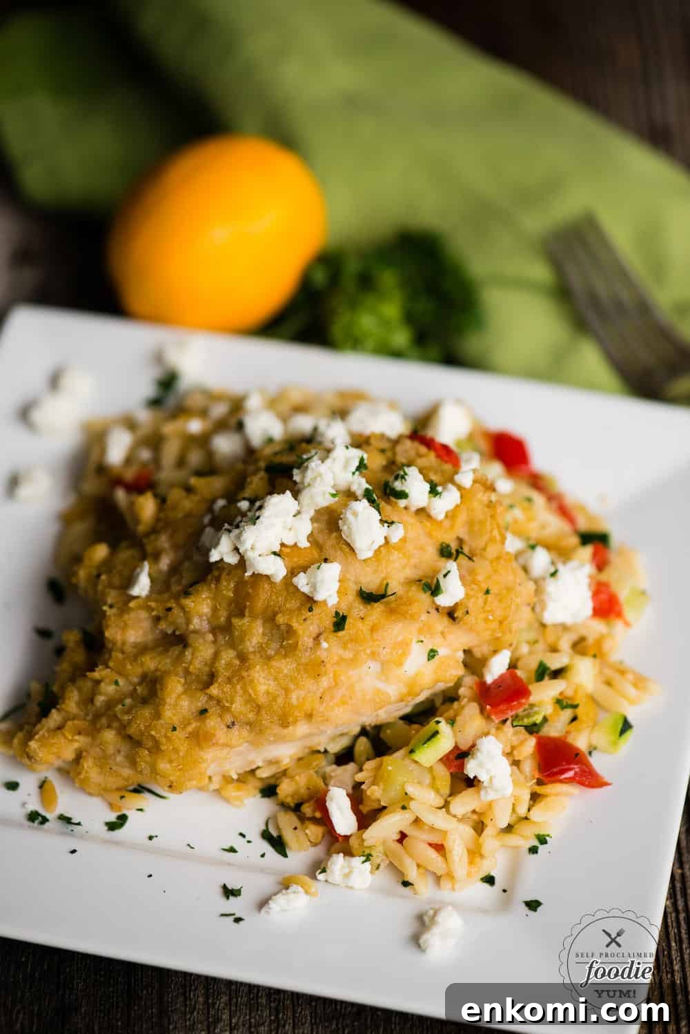 Hummus baked chicken with feta and vegetable orzo