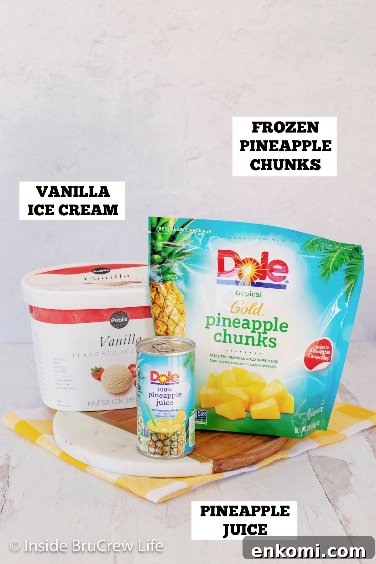 Homemade Pineapple Dole Whip Recipe — Creamy Tropical Soft Serve 3 A picture of vanilla ice cream, pineapple juice, and frozen pineapple.
