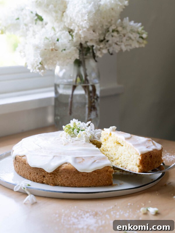 7 Wild Spring Flowers to Forage in the Pacific Northwest 33 A lemon and lilac cake in front of a vase of fresh lilac flowers
