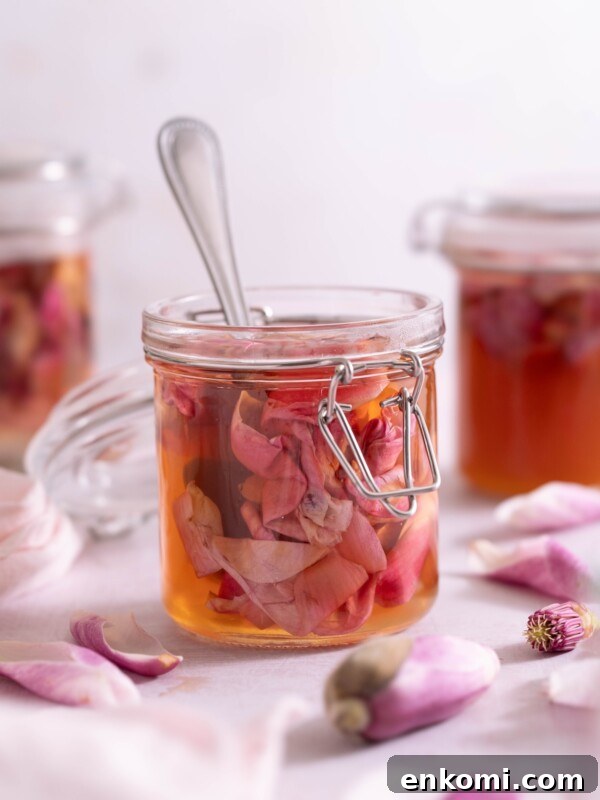 7 Wild Spring Flowers to Forage in the Pacific Northwest 6 A jar of pickled magnolia petals with fresh magnolia flowers around it