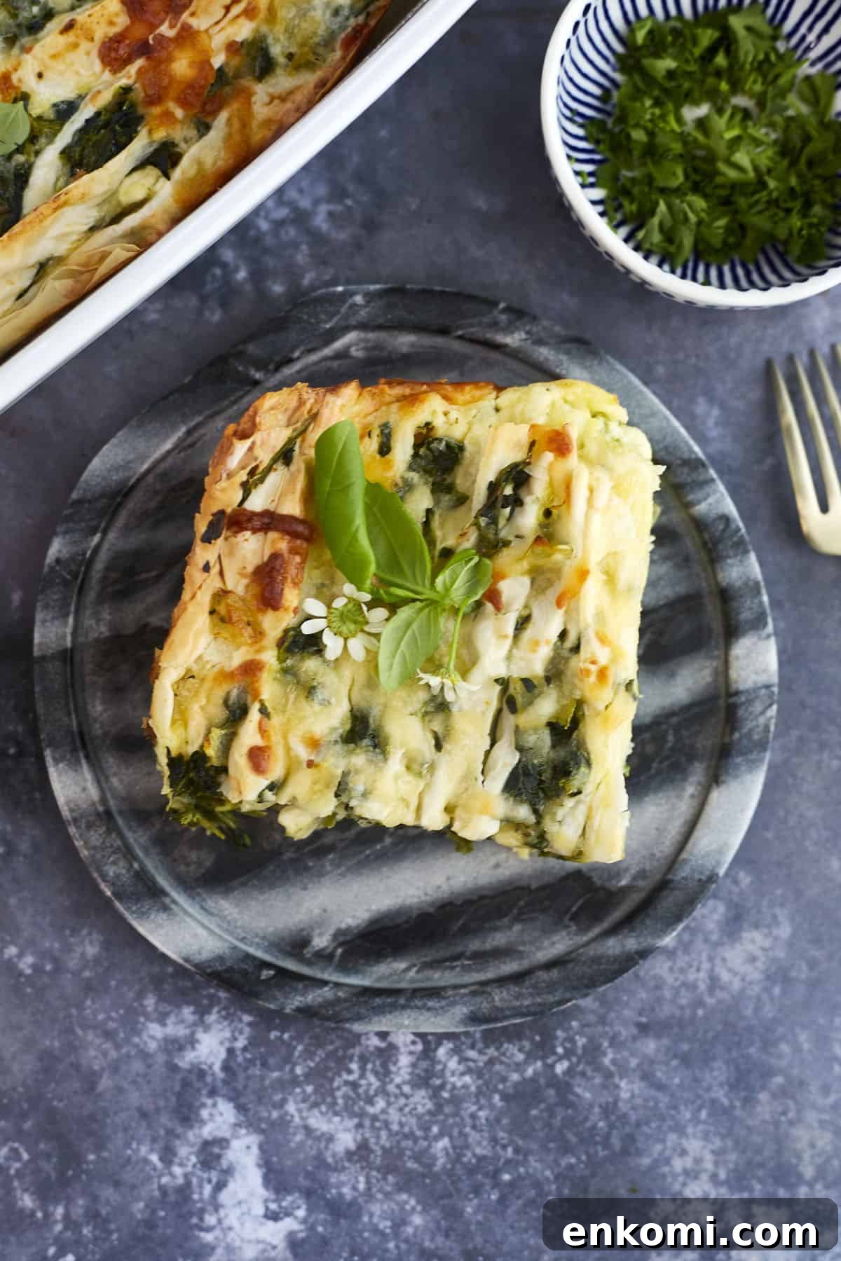 a slice of easy spanakopita recipe on a plate.