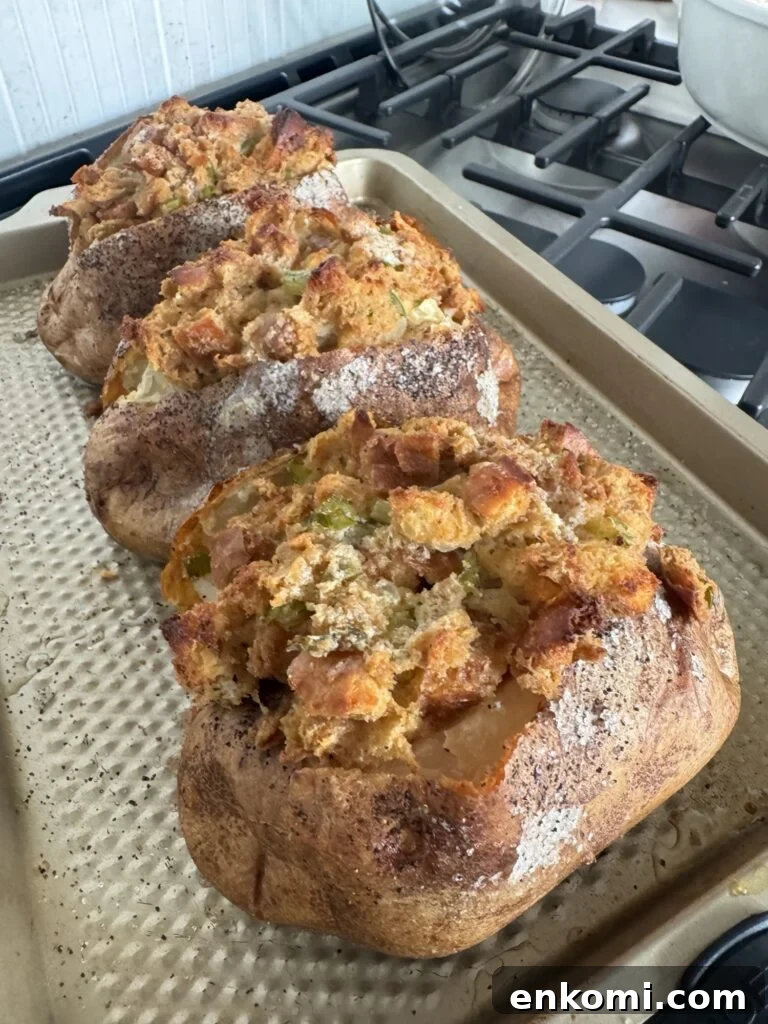 Thanksgiving Stuffed Potatoes Recipe: Flavorful Holiday Side Dish 6 The potatoes with stuffing baked on top