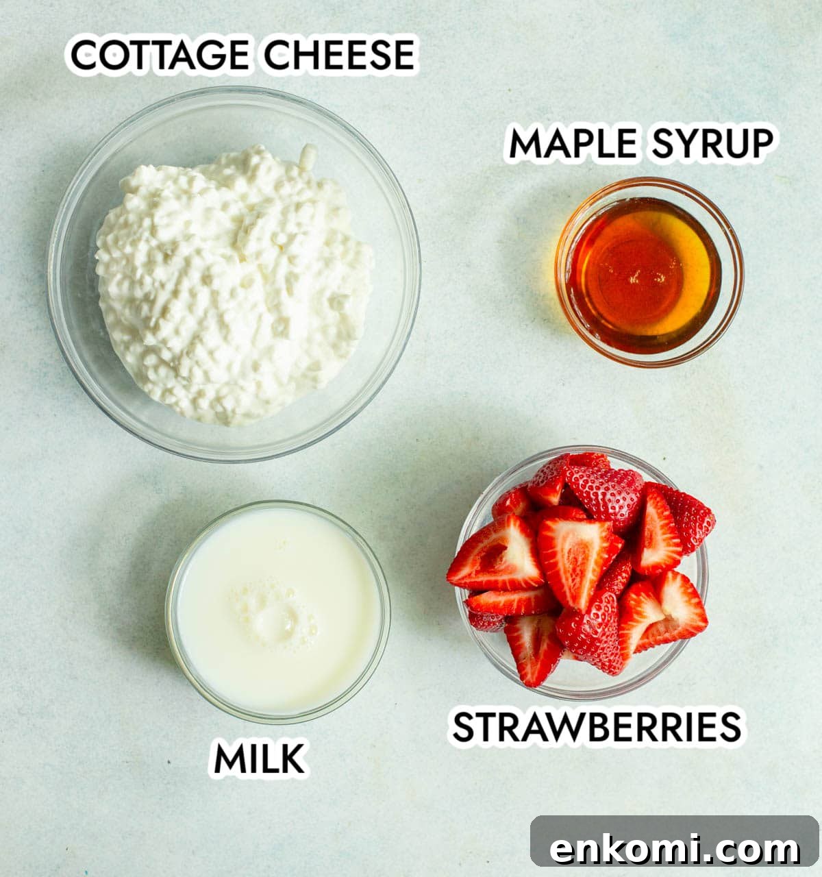 Ingredients in Strawberry Cottage Cheese Ice Cream on a gray background.