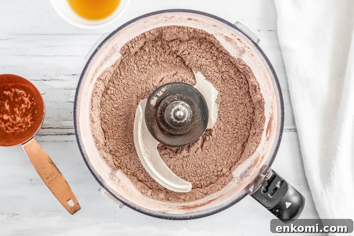 mixed dry ingredients for thin mints in a food processor.
