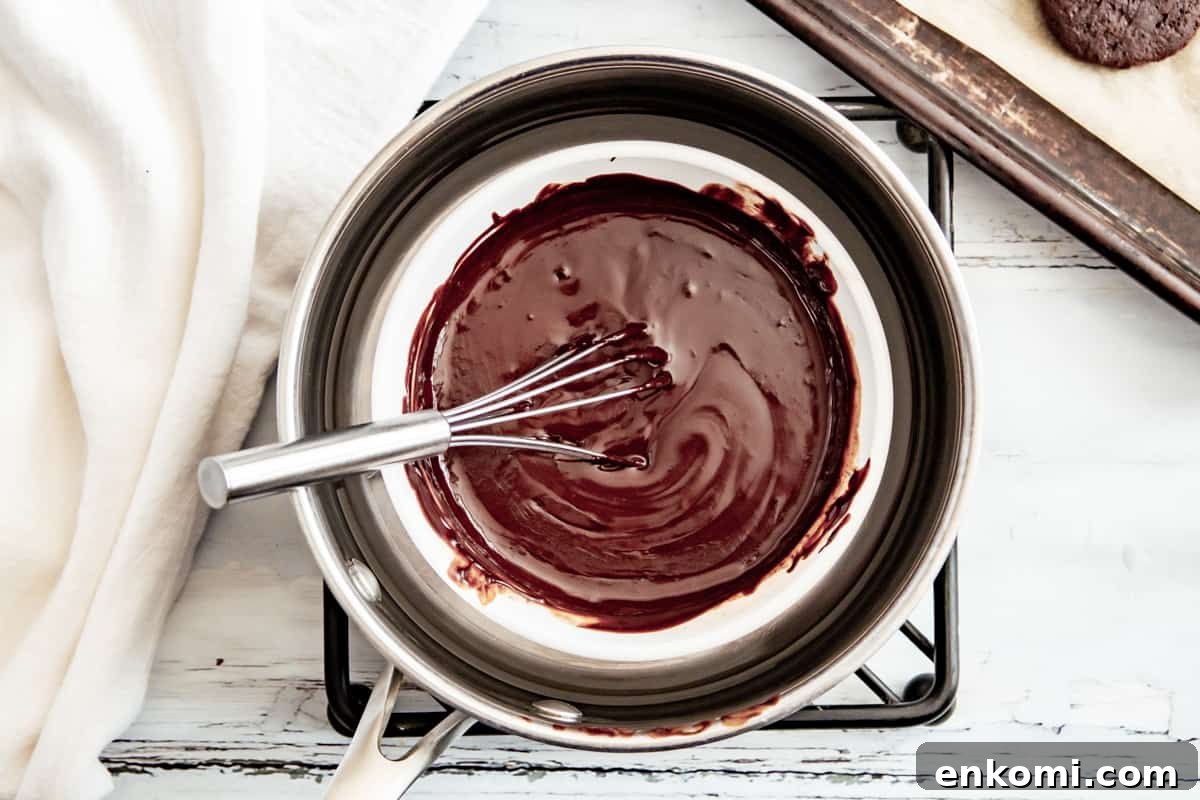 melted chocolate mint coating in a bowl with a whisk.