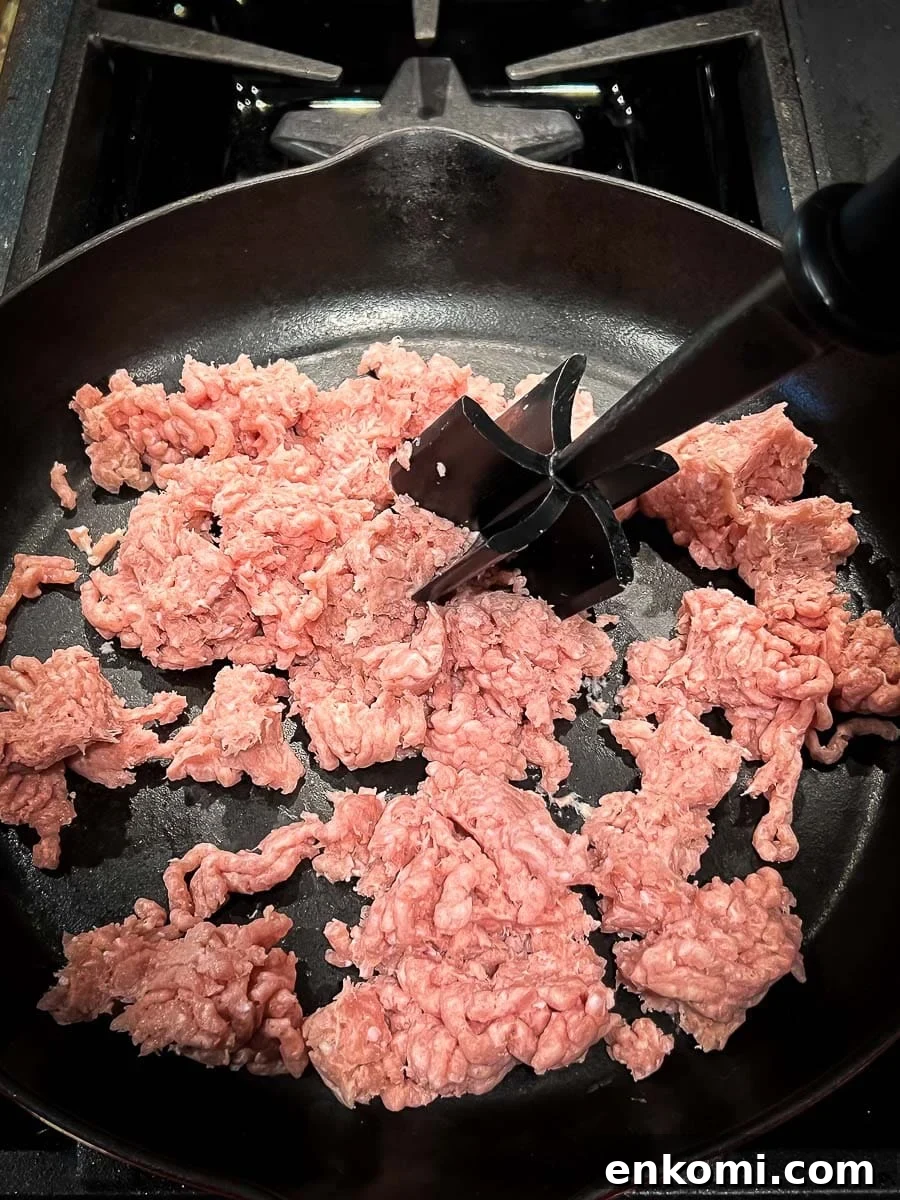 Creamy Sausage Gravy for Biscuits: Homemade Southern Recipe 4 cooking the ground turkey in cast iron skillet.