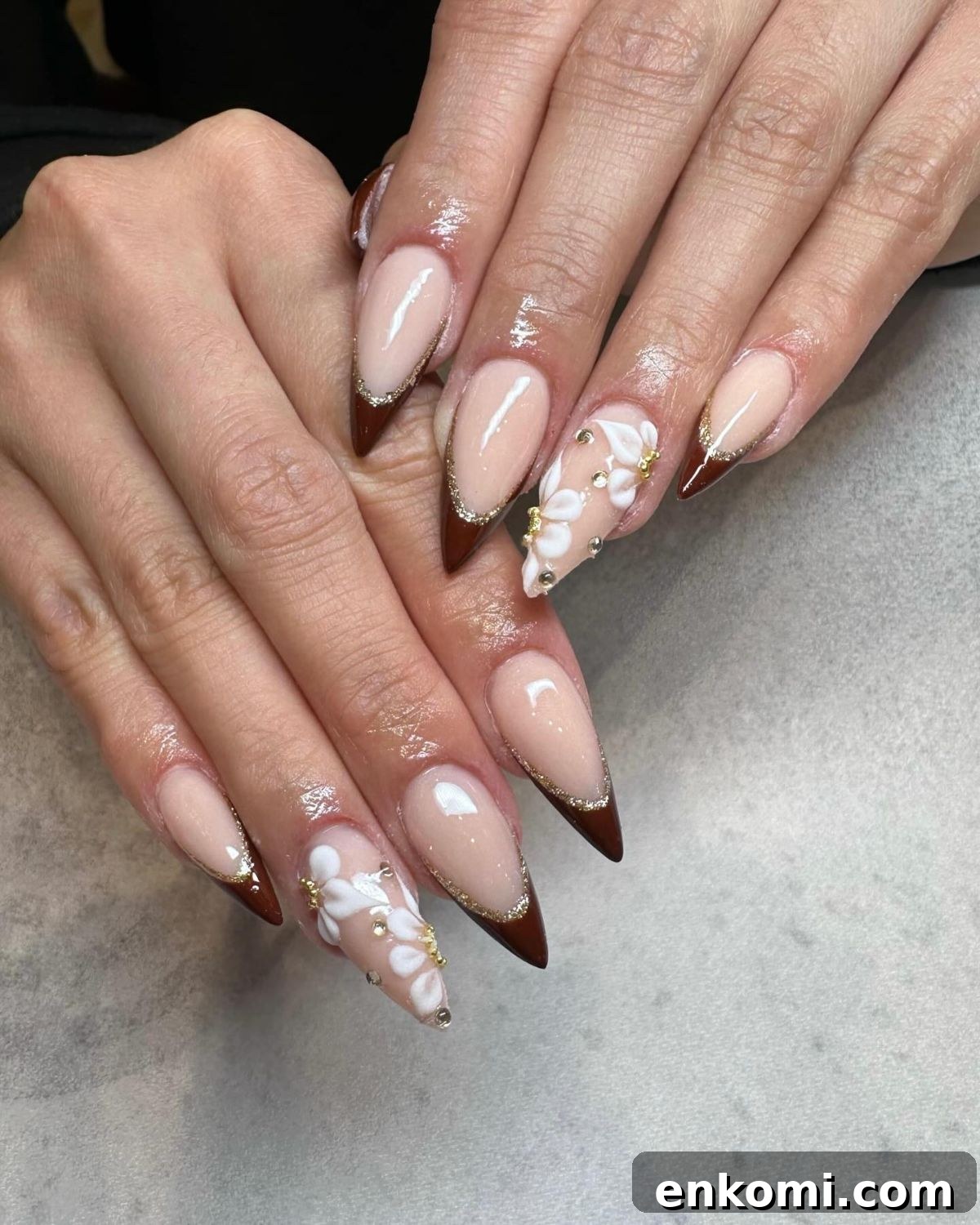 21 Elegant Almond Thanksgiving Nail Designs You’ll Love 9 7. Brown Tips with White Floral Accents