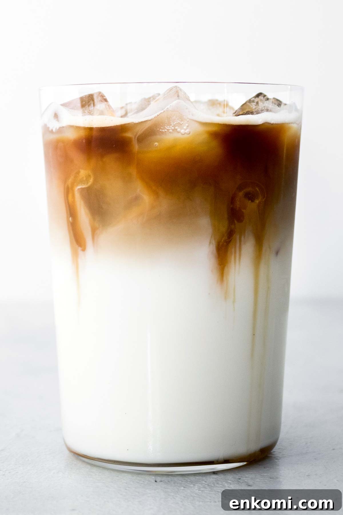 Iced Caramel Macchiato drink in a glass cup.