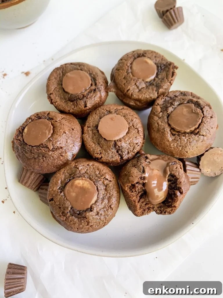 peanut butter brownie bites on a plate, one with a bite taken out