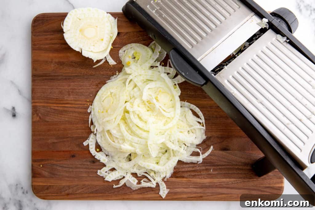 Greek-Style Grilled Eggplant Salad with Simple Grilling Tips 11 Process shot showing how to shave fennel on a mandoline.