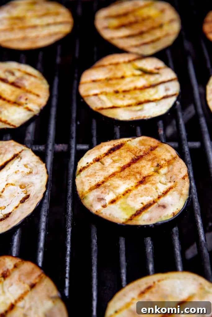 Greek-Style Grilled Eggplant Salad with Simple Grilling Tips 3 Eggplant slices on a grill.