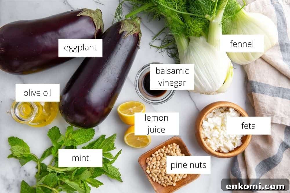 Greek-Style Grilled Eggplant Salad with Simple Grilling Tips 10 The ingredients for the eggplant salad arranged on a marble surface.