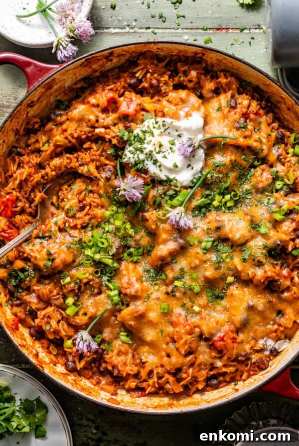 Strawberry and Cream Chocolate Layer Cake Recipe 9 taco rice in a large skillet topped with sour cream, cheese, and diced chives and green onions.