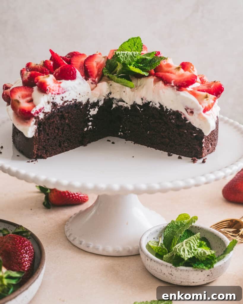 Strawberry and Cream Chocolate Layer Cake Recipe 4 Strawberries and cream chocolate cake on a cake stand