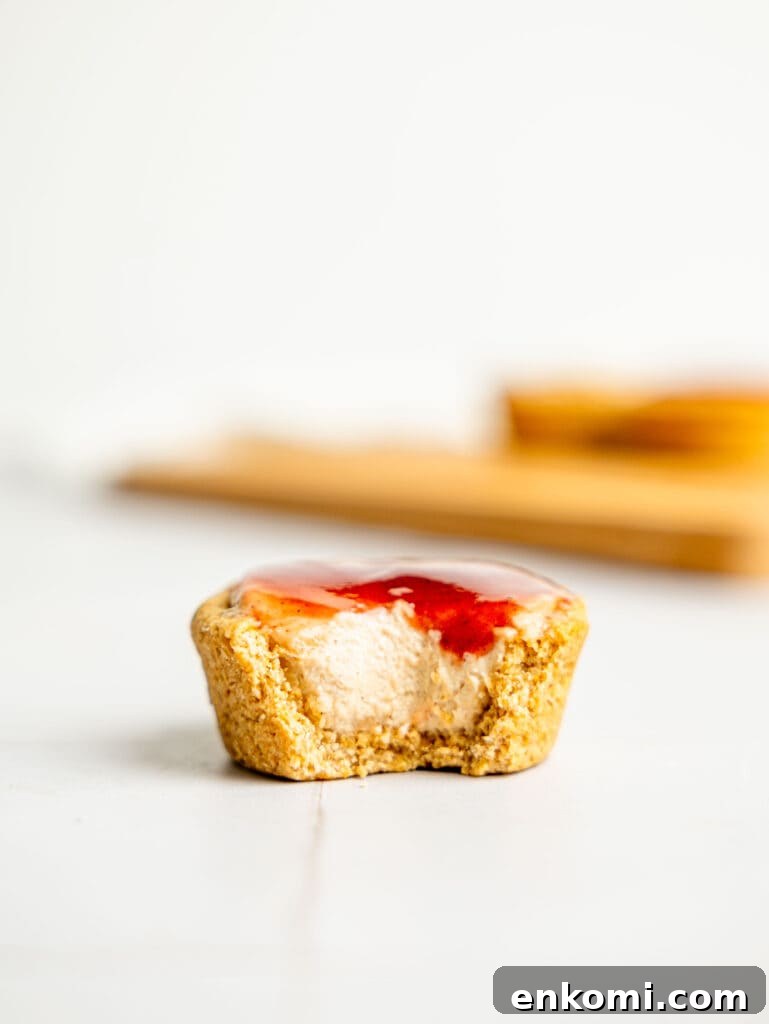 High-Protein Mini Cheesecakes: Low-Calorie Dessert Recipes 11 A half-eaten mini protein cheesecake.