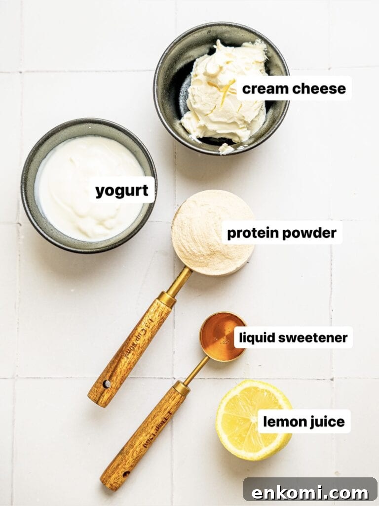 High-Protein Mini Cheesecakes: Low-Calorie Dessert Recipes 3 Protein Cheesecake Filling ingredients in measuring cups.