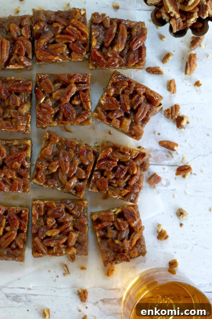 cut banana pecan bars on a sheet of parchment paper