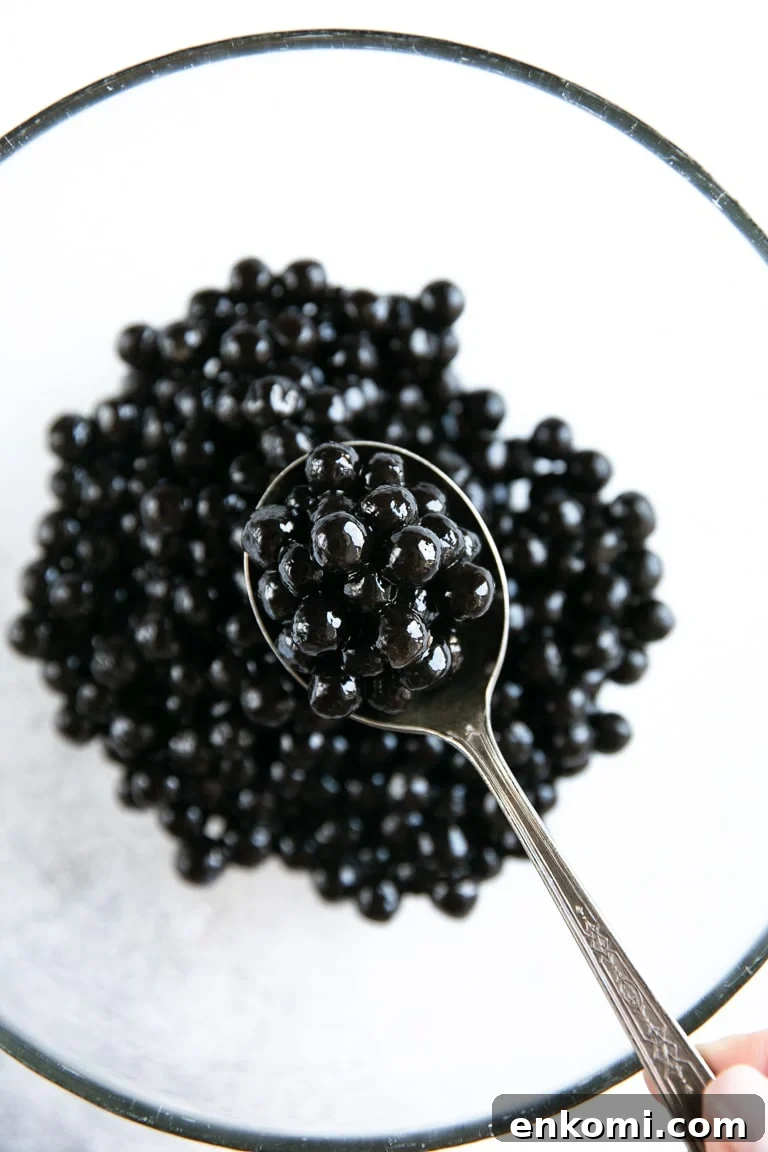 How to Make Authentic Bubble Tea at Home: Tapioca Pearl Recipe 5 Quick-cooking black boba on a glass bowl (tapioca pearls).