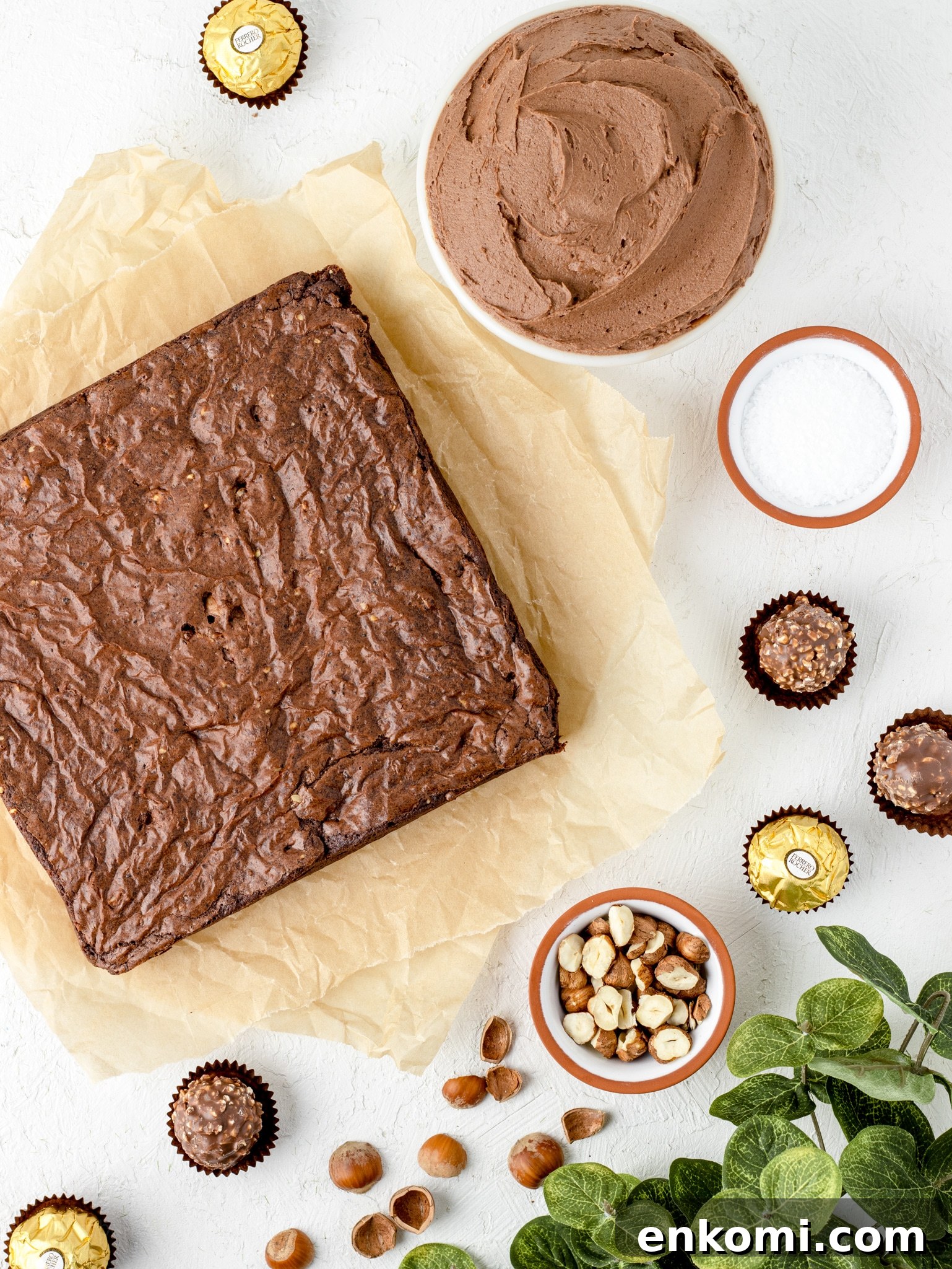 Main Ingredients for Ferrero Rocher Brownies. Brownies, Fluffy Hazelnut Frosting, Salt, Hazelnuts, and Ferrero Rochers.