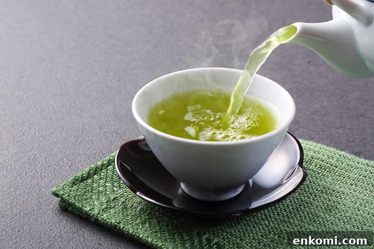 Top Teas That Help Support Weight Loss 3 Green tea leaves and cup