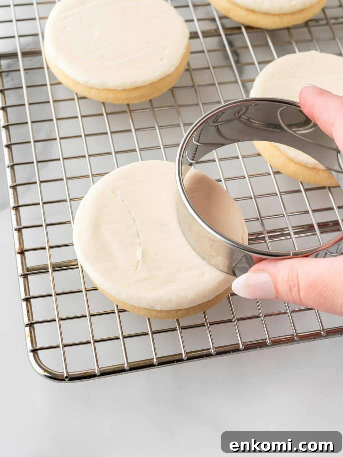 Baseball-Themed Sugar Cookies: Recipes and Decorating Tips 16 using a cookie cutter to make lines on frosted sugar cookie