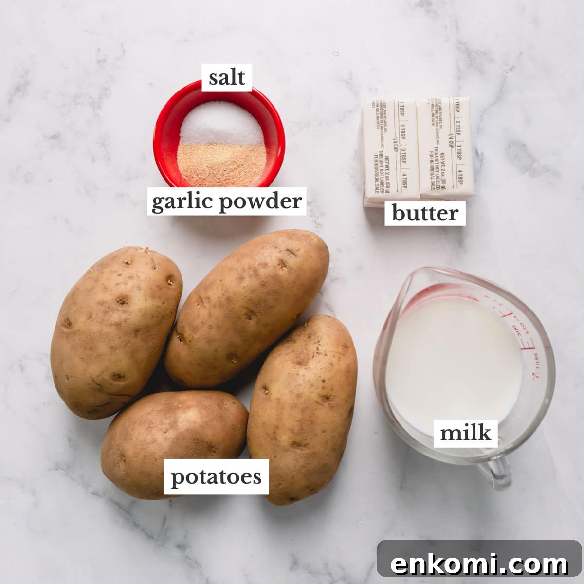 Potatoes, salt, garlic powder, butter, and milk to make brown butter mashed potatoes.