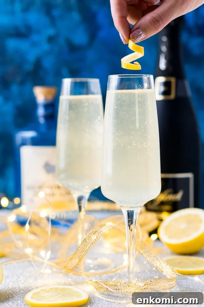 French 75 is a classic cocktail that combines bright citrus with the earthy notes of gin and the sparkle of champagne. A delicious drink recipe for parties, New Year's Eve, brunch, bridal showers and more!