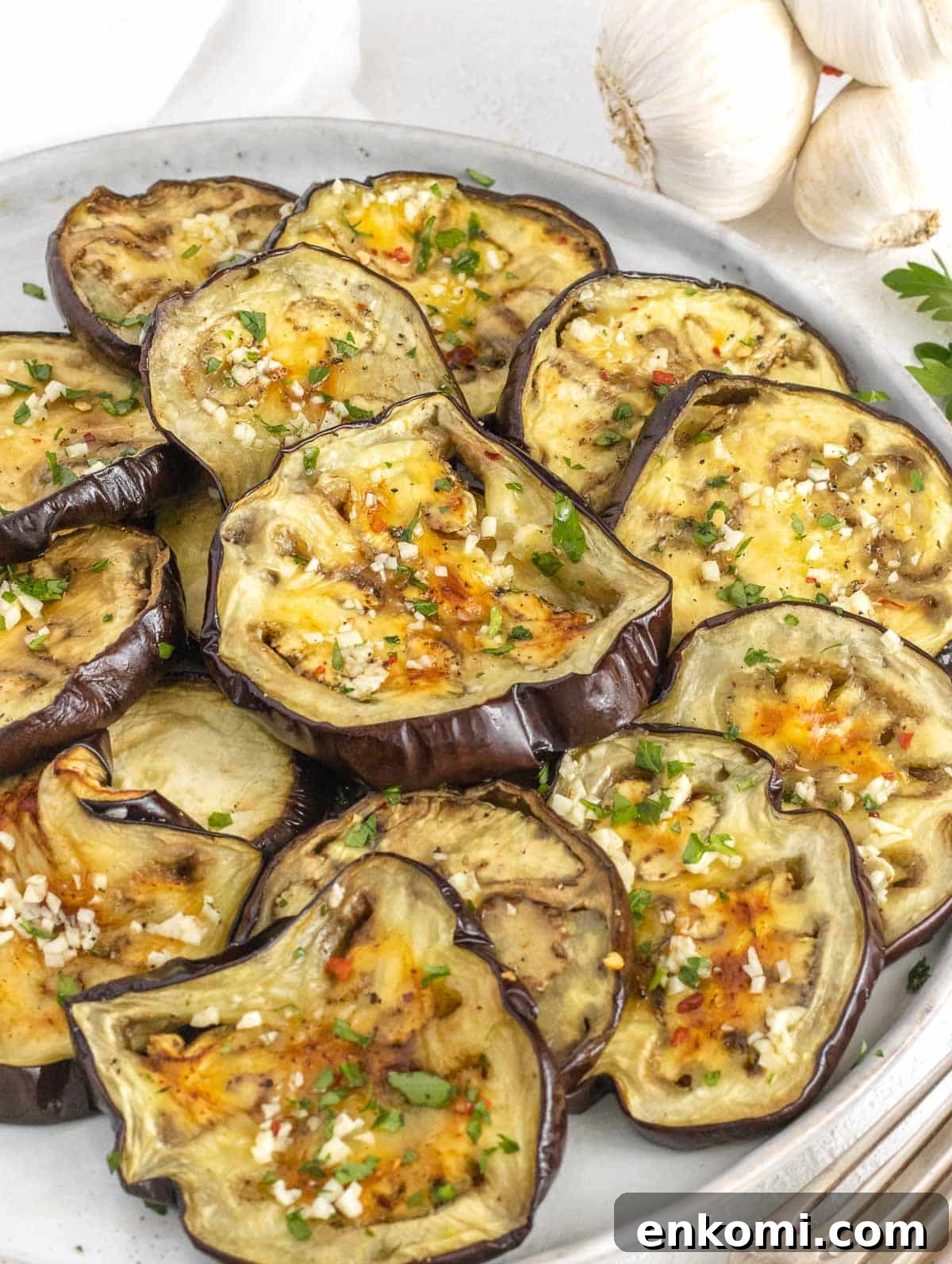 roasted eggplant slices with garlic and olive oil seasoning