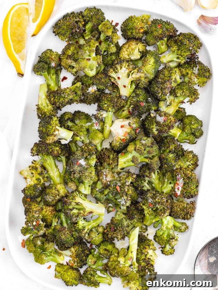 Roasted broccoli on a white platter